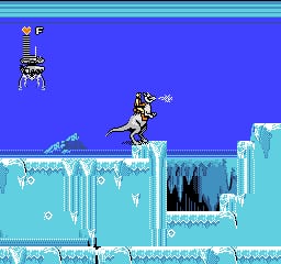 Luke Skywalker stands on an icy platform in the foreground, facing right with a lightsaber. The background shows a blue sky with a distant AT-AT walker in the center-right. Below, layered ice formations and frozen structures create a winter landscape with cyan and white coloring. A UI bar at the top displays a small character portrait icon and score information. The pixel art uses the NES's limited color palette with stark contrasts between the bright blue sky and pale icy terrain.