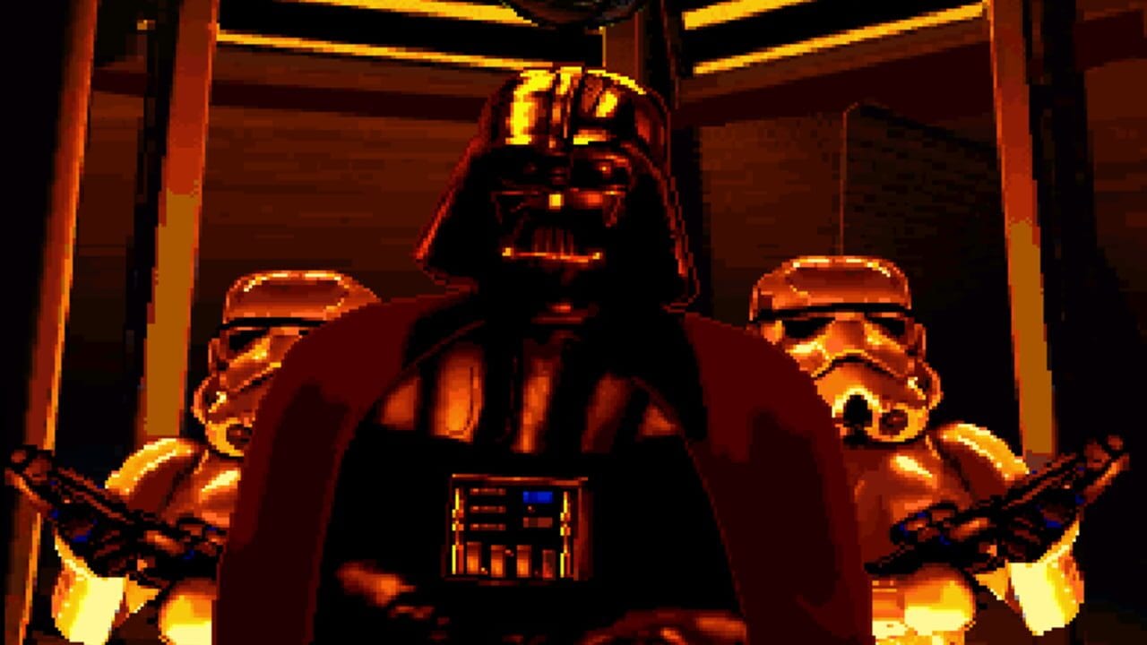 A space hangar interior rendered in orange and red tones displays Darth Vader standing centrally in a dark cape with an illuminated chest panel, flanked by two white-armored stormtroopers in identical poses. Yellow overhead lighting frames the scene with geometric architectural elements. The pixel art uses a warm color palette dominated by oranges and golds, characteristic of 16-bit era rendering.