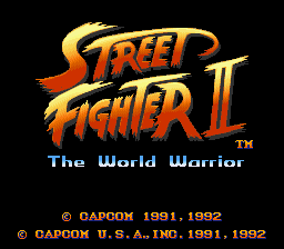 The Street Fighter II title logo appears in large orange and yellow lettering at the top center, with 'The World Warrior' subtitle in smaller blue text below. A black background fills the rest of the screen. At the bottom, copyright text reads '© CAPCOM 1991, 1992' and '© CAPCOM 1991, 1992' in white type, indicating the arcade and Game Boy versions.