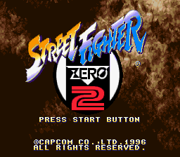 The title screen features a textured brown background with the "Street Fighter" logo in yellow and blue at the top, followed by "ZERO 2" in a white circle badge and red lettering below. At the bottom, white pixel-style text reads "PRESS START BUTTON" with copyright information for Capcom dating to 1996. The overall composition uses a warm, aged color palette typical of SNES-era fighting game presentations.