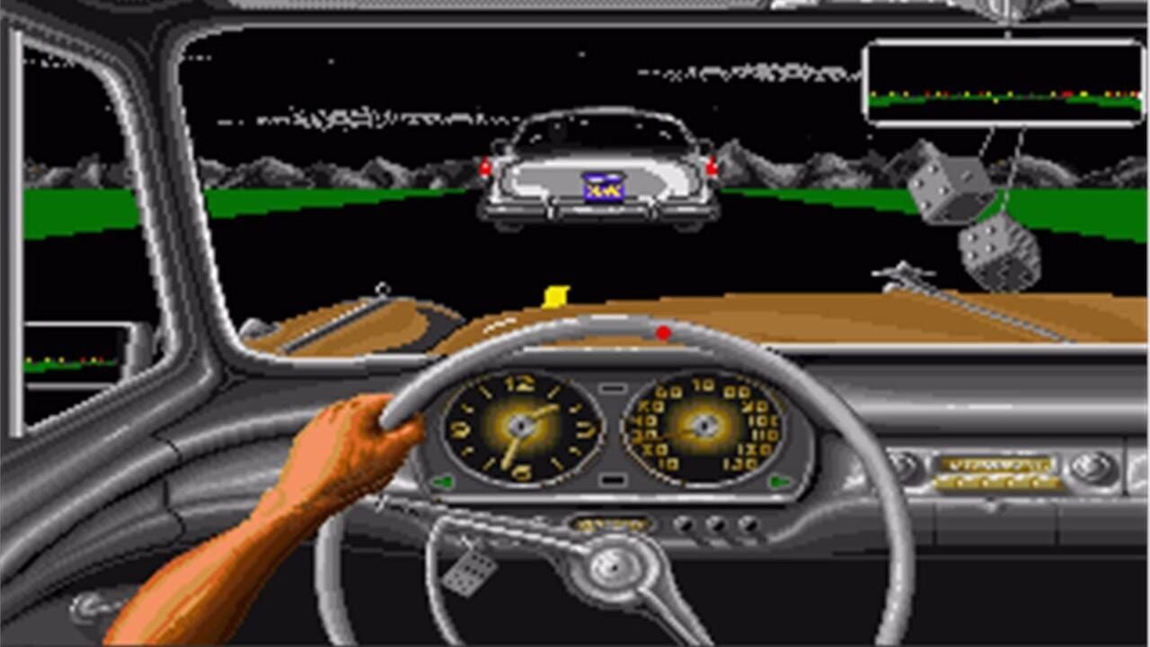 The driver's perspective from inside a car shows a detailed dashboard with two circular analog gauges displaying speed and RPM in yellow numerals against black faces. An orange-gloved hand grips a steering wheel. The windshield view displays a desert canyon road ahead with a gray guardrail on the left, brown rocky terrain, and a distant competitor's vehicle centered on the horizon with red headlights. The upper screen shows a top-down race map with green track borders and rocky obstacles. A green radar display appears in the top-right corner of the HUD.
