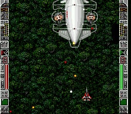 A top-down shooter view displays a silver spaceship centered in the upper portion of the screen against a dark green forest or jungle background with black pixels forming dense vegetation texture. Below the ship, a smaller player-controlled fighter craft in red and gold colors floats in the middle of the screen. Two yellow explosions or projectiles appear near the center, with yellow bullet traces visible. The left and right edges show bright neon-colored UI elements in green, red, and white, forming a decorative game border frame with geometric patterns.