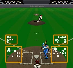 A baseball game in progress on a green field with a batter positioned at home plate in the lower center and a pitcher on the mound in the upper center. Two stat panels flank the field horizontally: the left panel shows blue team information with scores, and the right panel displays the opposing team in blue uniform with similar stats. A small white ball is visible mid-field. The scene uses SNES-era sprite graphics with a brown dirt infield contrasting against the bright green outfield grass and stadium background.