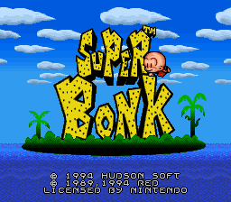 The title screen displays "SUPER BONK" in large yellow pixelated letters against a bright blue sky with white clouds. Below the title sits a small island silhouette with two palm trees flanking its edges, positioned over blue water. The lower portion shows copyright text reading "© 1992 HUDSON SOFT" and "© 1992 TURBO TOGRAFX-16", along with what appears to be a cartridge release date. The art uses a vibrant 16-bit color palette with bold sprite work typical of early 1990s console graphics.