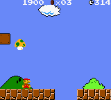 A Game Boy screenshot displays Mario on a brick platform in the lower-left portion of the screen against a solid blue sky. A green pipe sits to the right on the same platform, with brown and green brick blocks forming the ground level. The HUD shows the score "1500" and "$314" in the top-left corner, with a small Mario icon beside them. The pixel art uses the characteristic 8-bit Game Boy color palette of greens, browns, reds, and yellows on a monochrome blue background.
