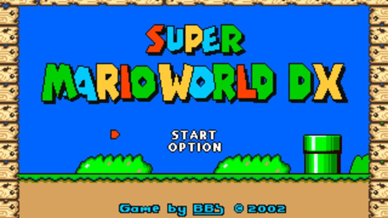 The title screen displays 'SUPER MARIO WORLD DX' in large, multicolored pixel letters against a bright blue sky background. Below the title, 'START OPTION' text appears in white. The lower portion shows a brown ground with green bushes and a green warp pipe on the right side. A brick pattern border frames the entire screen. At the bottom, cyan text reads 'Game by BB$' with a copyright symbol and '2002'.