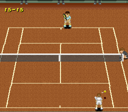 A clay tennis court viewed from above shows two pixelated player sprites positioned at opposite ends of the court. The upper player stands near the baseline while the lower player is closer to the net. White lines mark the court boundaries and service boxes against the brown clay surface. A gray net divides the court horizontally in the middle. The score display reads 15-15 in the upper left corner. The sprite resolution and color palette are characteristic of early SNES graphics.