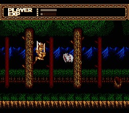 A warrior character stands on a platform in the center of the screen, surrounded by two tall wooden pillars with flame-like details. The background features a dark interior with blue/purple shadowed areas and red geometric patterns. At the top is a HUD bar labeled "PLAYER EXP" in gold text. The bottom edge displays a decorative border with repeated small square patterns in red and yellow. The sprite style uses limited colors with dark greens, reds, and blues against a primarily black background, typical of early NES graphics.