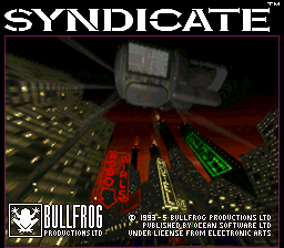 The SYNDICATE title logo in white text appears at the top of the screen. Below is a 3D isometric view of a futuristic cityscape with red and green neon-lit buildings, yellow streets, and gray geometric structures. The scene uses a limited color palette with pixelated architecture rendered in low-polygon style typical of early 1990s 3D graphics. The Bullfrog Productions logo and copyright text appear in the bottom left corner, with publishing credits visible at the bottom of the screen.