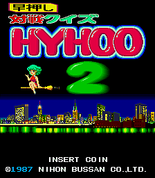 The title screen displays "TAISEN QUIZ HYHOO 2" in large red and green pixel lettering at the top center. A small sprite character stands on the left side of the screen wearing yellow. Below the title is a green numeral "2". A detailed pixel-art cityscape with buildings in green, yellow, and blue fills the bottom third of the screen against a black background. Copyright text reading "INSERT COIN" and "©1987 NIHON BUSSAN CO.LTD." appears at the bottom in white text.