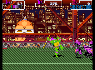 A green-clad ninja turtle stands in the center of a horizontally scrolling urban street level, facing right toward purple mutant enemies. Tall stylized buildings with orange and brown tones fill the background in a parallax cityscape. The foreground displays green-striped pavement. A score and status panel spans the top of the screen with orange text and UI elements. Pixel sprites render characters and enemies in bright, saturated colors typical of early-1990s arcade hardware.