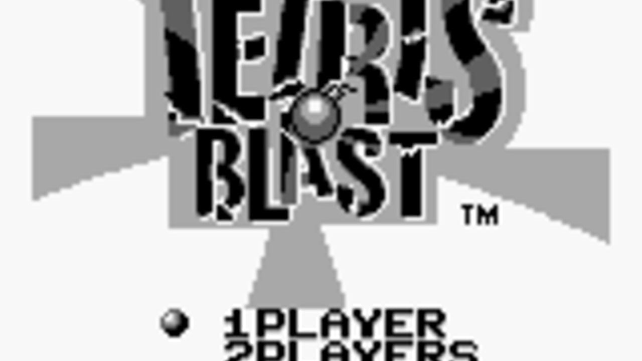 The Tetris Blast title logo dominates the center of the screen in large black and gray pixelated text, with a small metallic sphere positioned above it. Below the logo, gray geometric shapes form a triangular base. In the lower portion, white text reads '1PLAYER' and '2PLAYERS' with a small spherical icon to the left. The background is light gray with black sections framing the design elements. A TM symbol appears to the right of the title.