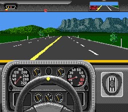 A racing game view displays a wide highway stretching toward distant rocky mountains under a clear blue sky. The road features yellow center line markings and white dashed edge lines. A detailed instrument cluster dominates the lower half, showing speedometer, tachometer, and fuel gauge with analog needles. A minimap appears in the upper right corner. The road ahead is empty except for vegetation on both sides, rendered in low-resolution SNES-era sprite graphics with parallax scrolling hills in the background.