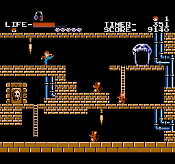 A brick-walled dungeon level displays a player character in the lower-left area near a torch, with a floating ghost enemy visible in the upper-right section. The HUD shows LIFE with seven units, TIMER at 336, and a score of 9130 at the top. Multiple wooden platforms and doorways are scattered across the brown-brick environment against a black background. The sprite-based graphics use a limited color palette typical of 1987 NES hardware.