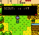 A Game Boy screen displays an overworld area with a grid-based grass and dirt terrain in yellow and green. A small pixelated character stands in the center. A black dialogue box at the top reads "SCOUT: IS IT?" in white text. The top status bar shows a health meter, item icons, and a score counter reading "000". The art style features typical Game Boy Color sprite resolution with distinct color blocks and minimal anti-aliasing.