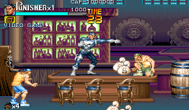 A character in white and black armor stands center-right on a wooden tavern floor, firing a gun toward enemies. Three brown wooden chairs line the foreground, with explosive effects and yellow/orange flame sprites visible near enemies on the left. A purple curtained wall with six portrait frames occupies the background left, while a large ornate mechanical wheel design appears upper right. The HUD displays "FINISHER×1" in red at top-left, with "VIDEOGAME" text and score readout visible in the upper-left corner. The color palette emphasizes purples, browns, and metallic tones against pixel-art sprite graphics.