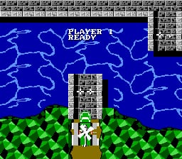 A vertical scrolling shooter view displays a blue starry sky background with white lightning bolt patterns, a tall gray brick tower structure in the center with a white helicopter sprite at its base, and green pixelated terrain in the foreground. The HUD shows 'PLAYER 1' text in the upper left and a score/status panel on the right side. A tile-based brick pattern fills the top edge of the screen, typical of NES-era 8-bit graphics with limited color palette and visible pixel resolution.