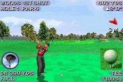 A golfer in red shirt stands on a bright green fairway holding a club mid-swing. A white golf ball is visible in the lower-right corner. The HUD displays distance readouts on the left ("UP 300 YDS") and club selection on the right ("CLUB: 9"). A red flag marks the hole in the distance on an elevated green. Text at top shows "WOODS 1ST SHOT" and "HOLE 1 - PAR 4" with score information. The scene uses flat sprite graphics typical of GBA golf games with minimal detail in the background landscape.