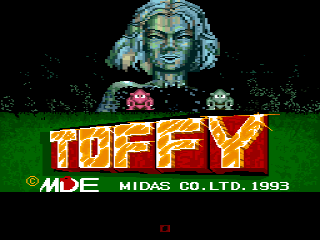 The title screen displays a large pixelated face with green-tinted skin and white hair at the top center, positioned above the word 'TOFFY' rendered in yellow and orange gradient lettering. Below the title, white text reads '© MDE MIDAS CO.LTD. 1993' on a dark green horizontal band. The background is black with a green ground area at the bottom. A small red pixel element appears at the very bottom of the screen.