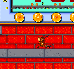 A small pixelated character sprite stands on a red brick wall pattern in the center-left portion of the screen. The background shows repeating red brick blocks with a gray stone base. At the top of the screen, a horizontal HUD displays health hearts, numerical values, and a score counter. Below the HUD are four golden coin icons arranged horizontally across the screen. The overall art style uses 16-bit sprite graphics with a limited color palette of reds, grays, and yellows.