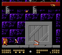 A side-scrolling level displays Tom and Jerry sprites within a room composed of purple brick walls and a gray square door or platform in the center. The HUD at the top shows a red bar, score counter reading 000000, a middle display, and another 000000 score with "LICH" text on the right. Tom stands on the left side while Jerry appears near the center-bottom area. The sprite-based graphics use a limited NES color palette of reds, purples, grays, and blacks against a dark background.