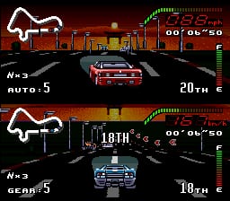 Two split-screen racing views show top-down perspectives of a nighttime cityscape with neon road markings. The upper panel displays a red car approaching an intersection with a speedometer reading 20 mph, lap counter showing 1/3, and track position indicator in the upper right. The lower panel shows a blue car at 18 mph on the same track segment. Both scenes feature pixelated sprite-based graphics with a dark background, yellow building silhouettes, green digital dashboard elements, and white lane markings creating a sense of forward motion.