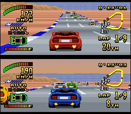 Two split-screen racing views display cars on a desert highway with rocky terrain and blue sky. The top screen shows a red car in first place at 20 km/h distance, while the bottom shows a blue car in second place at 8 km/h distance. Both screens feature identical HUD layouts along the left side showing lap information, gear selection, and speed indicators. The road curves ahead with sandy landscape visible on either side. Low-resolution sprite graphics and visible scan lines are characteristic of early 16-bit racing game visuals.
