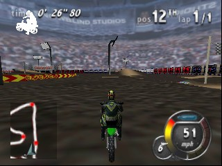 A motorcycle rider in green and black sits centered on a dirt track racing course, viewed from behind. The HUD displays lap time 0'26"80 in the top-left corner, position 12th with 12 laps total in the top-right, and a speedometer reading 51 in the bottom-right. The track is bordered by yellow and black striped barriers on both sides, with industrial structures and grandstands visible in the background under a dusky sky. The 3D graphics render the motorcycle, terrain, and environment in low-polygon N64-era style with muted earth tones.