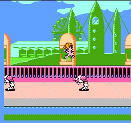 A side-scrolling level displays a colorful pixel-art landscape with bright blue sky, green pyramidal trees, and yellow sun in the background. A troll character with orange hair stands in the center foreground on a peach-colored ground platform. Two additional troll characters with round bodies appear in the lower portion of the screen. A purple spiked barrier runs horizontally across the middle section. Green grass ground is visible at the bottom edge. The NES-era sprite work uses a limited color palette with distinct pixelated character and environmental designs.