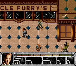 A top-down interior level view displays a tiled floor in tan and dark blue checkerboard pattern. A player character sprite stands in the center-right area wearing dark clothing. Two enemy sprites in green and yellow uniforms are positioned in the lower-right corner. Wooden-framed doors and brown walls line the perimeter. At the top left, partial text reading "CLE FURRY'S" appears in a menu or header bar. A black HUD bar at the bottom displays game information and UI elements. The visual style uses 16-bit SNES-era sprite graphics with a limited color palette.