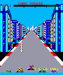 The title screen displays 'TURBO' in red letters at the top center against a bright cyan background. A straight road stretches into the distance between tall blue and purple buildings on both sides, creating a perspective view down the street. A white dashed line marks the center of the road. At the bottom, five colorful small vehicles are arranged in a row: a green car on the far left, followed by red, yellow, pink, and purple cars. The pixel art uses a limited palette with blocky sprite graphics typical of early 1980s arcade games.
