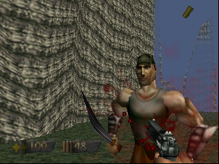 A muscular male character in a tan shirt stands in a stone corridor with his fists raised, facing left. Red geometric shapes float near his torso. A bow is visible in his left hand. The background shows textured brick walls and a blue-tinted sky visible through an opening. The HUD displays health and ammo values in the lower left corner. Low-polygon 3D graphics with flat-shaded textures and visible pixelation typical of Nintendo 64 hardware.