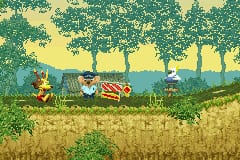 A character rides in a mine cart moving left across a sunlit field of golden grass. Layered background elements show green trees and foliage in silhouette against a yellow sky, with parallax scrolling creating depth. The sprite-based character and environment use a warm color palette typical of Game Boy Advance hardware, with visible pixelation throughout the scene.