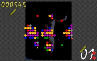 A black game field displays colorful pixelated bubble clusters in purple, blue, yellow, and red arranged in scattered groups across the center. A single green bubble appears in the lower-right area. The upper-left corner shows a yellow score display reading "000545" with a yellow line graphic below it. The upper-right corner displays a white "01" indicator. The background has a gray diagonal crosshatch pattern around the game field edges.