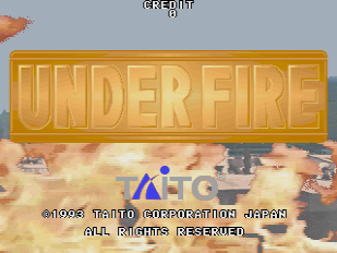 A large golden embossed title logo reading "UNDER FIRE" dominates the upper half of the screen. Below it sits the Taito Corporation Japan logo in blue lettering. The background displays a war scene with pixelated terrain, military vehicles, and explosions in warm orange and brown tones. Copyright text and legal notices appear at the bottom of the screen in small white font.