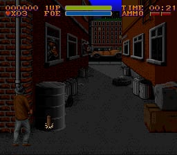 A first-person corridor view rendered in low-resolution 16-bit graphics displays a dark brick building interior with wooden doors and windows lining both sides. The player character appears as a small sprite at the corridor's center-bottom. The top HUD shows a health bar in blue and green, a score counter labeled "000000", ammunition count "10", and a timer reading "00:21". The color palette consists of browns, reds, blacks, and grays, creating a dim indoor atmosphere typical of early SNES dungeon crawlers.