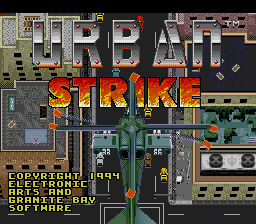The title screen displays "URBAN STRIKE" in large red and yellow pixelated letters across the center of a top-down isometric game map showing buildings, streets, and terrain. Below the title text appears green Cyrillic script and Latin characters. The background reveals a detailed overhead view of an urban environment with gray buildings, roads, green vegetation, and scattered ground-level details rendered in the Game Boy's limited color palette of grays, greens, and browns.