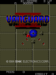 The title screen displays "VANGUARD" in large blue letters centered on a military grid background in olive and brown tones. Above the title, a score counter reads "HI-SCORE 2 UP" in white text. Below the logo, a blue circular spaceship sprite is surrounded by four red diamond-shaped enemy objects arranged symmetrically. A vertical white line divides the screen down the center, reinforcing the grid pattern. The copyright notice "© 1984 SNK ELECTRONICS CORP." appears at the bottom, with "PAGES 0" and "DEFAULT" displayed in the lower corners in small white text.