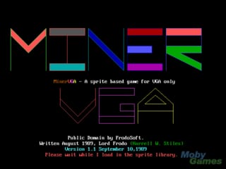 The title screen displays a large colorful logo at the top featuring geometric shapes in orange, gray, blue, red, pink, cyan, green, and purple. Below this sits the text "PhoenixCat - A sprite based game for DOS only" in small white letters. The lower half shows a simple wireframe house illustration in brown lines against the black background. At the bottom, white text displays game credits including "Ruthless Programmer," "Written August 1989," "Lord Krade," and version information dated September 10, 1989. A small "Gamer" label appears in green text in the bottom right corner.