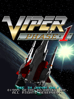 The title screen displays the Viper Phase 1 logo in large metallic silver and gold letters at the top center. Below it, two red and white spacecraft are shown against a starfield background with a bright lens flare effect in the upper right. Copyright text for Seibu Kaihatsu and All Rights Reserved appears at the bottom in small white lettering. The overall aesthetic uses a dark space setting with contrasting bright highlights.