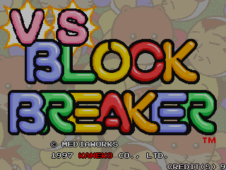 The title screen displays large colorful text reading "VS BLOCK BREAKER" with each word in a different color—purple, blue, yellow, red, and orange—in a bold pixel font. Below the title, copyright text reads "© MEDIAWORKS 1997 KANEKO CO., LTD." and "CREDITS GO" in smaller type. The background shows a tan-colored tileable pattern with brown geometric shapes. A trademark symbol appears in the lower right corner. The overall aesthetic is typical of late-1990s arcade cabinet graphics with bright primary colors and chunky sprite-based lettering.