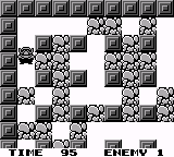 A Game Boy screenshot displays a top-down maze level with a checkered border of gray stone tiles. The play area features a symmetric layout of dark gray and white floor tiles arranged in an E-shaped or corridor pattern. Text reading 'TIME 95' appears in the lower left corner, and 'ERECT' is visible in the lower right, both in a pixelated font. The monochrome palette and low resolution are characteristic of original Game Boy graphics.