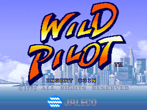 The title screen displays "Wild Pilot" in large orange and yellow letters with blue outlining against a light blue sky background. Below the logo is a cityscape with white buildings and a waterfront visible across the middle of the screen. A water texture with wave patterns appears in the lower portion. The Jaleco publisher logo is centered at the bottom in blue text, with "Flight Sim" visible above it on the left side.