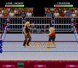 Two wrestlers face off in a boxing ring during a match. The wrestler on the left wears brown and gold attire, while the opponent on the right wears red. A crowd of spectators fills the background in blue and orange tones. The ring features yellow geometric patterns on the mat and is bordered by blue ropes and barriers. Player health bars labeled "LUNA VACHON" and "YOKOZUNA" appear at the top in red sections. The lower portion displays a red banner with four WWF logos.