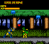 Wolverine stands in the center of a side-scrolling forest level with blue water and brown tree trunks. A yellow enemy character appears to the right. The top-left displays "WOLVERINE" text with a health bar showing red, yellow, and green segments. The sprite-based graphics use a limited palette of blues, greens, browns, and yellows typical of Game Boy hardware. Grass and foliage form the ground layer with a darker forest background.