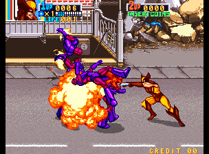 A purple mutant character engulfed in orange flames occupies the center of the screen during combat. A smaller red-clad opponent stands to the right mid-attack. The arcade interface displays a score counter reading "0000" at the top, with a health or status bar visible. The background shows a street environment with buildings and windows. Inset panels in the upper corners show additional gameplay scenes, including another character and environmental details. The sprite work uses bright color saturation typical of early 1990s arcade hardware.