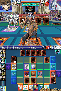 A Yu-Gi-Oh! trading card game duel interface displays two players facing each other across a blue arena platform. The top screen shows both duelists' life points (9000 each) and card hands, with ornate golden pillars flanking the scene. The bottom screen presents a grid-based card field with multiple colored card slots, deck icons on the left side, and portrait thumbnails of available cards at the bottom. Character artwork appears in the upper corners, rendered in 2D sprite style typical of Nintendo DS games.
