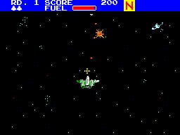 A starfield background fills the black screen with small white dots scattered across it. In the center of the screen, a green wireframe spaceship with angular geometry hovers horizontally. Above it, an orange explosion effect bursts with bright pixels. The top-left corner displays game information: "RR: 1 SCORE 200" with a red health bar. A yellow "N" indicator appears in the top-right. The scene uses low-resolution 8-bit sprite graphics typical of 1987 SMS hardware.