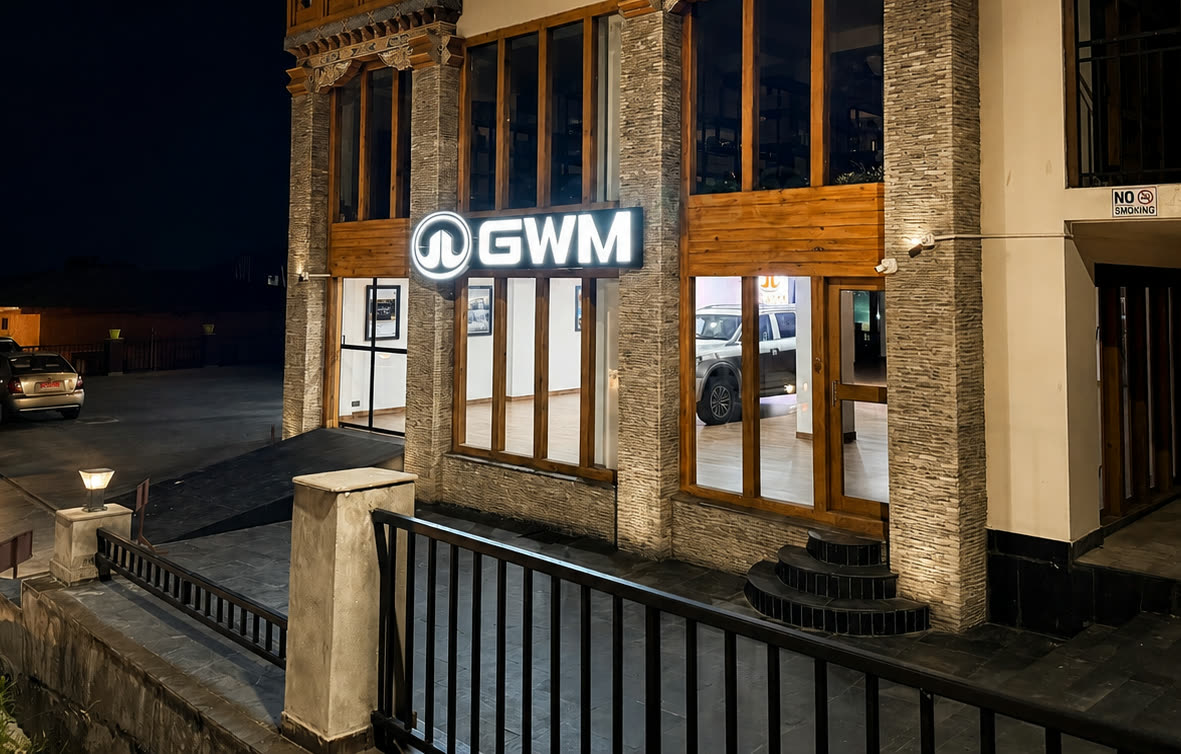 GWM-branded showroom entrance at night