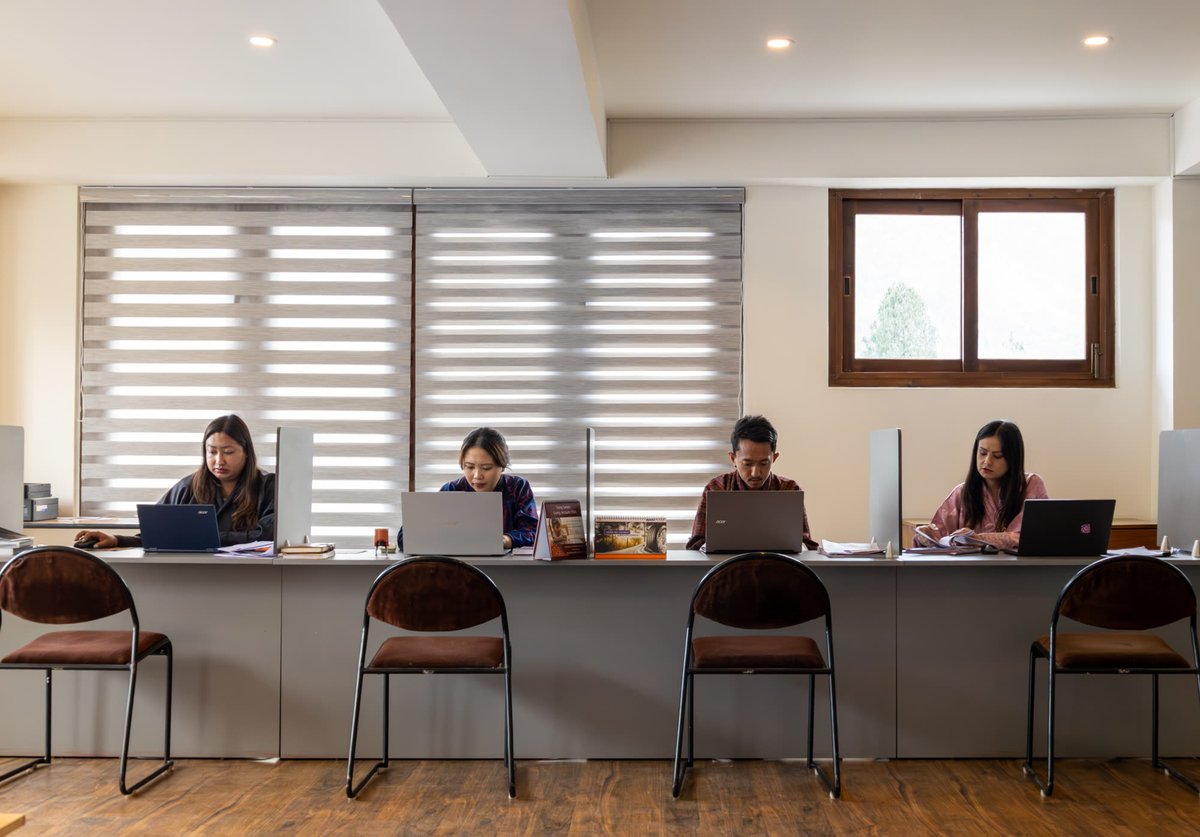 Team at workstations along the office desk